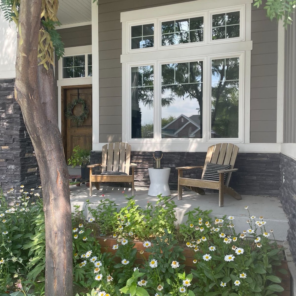 Sparkling clean front windows on a home with a covered porch